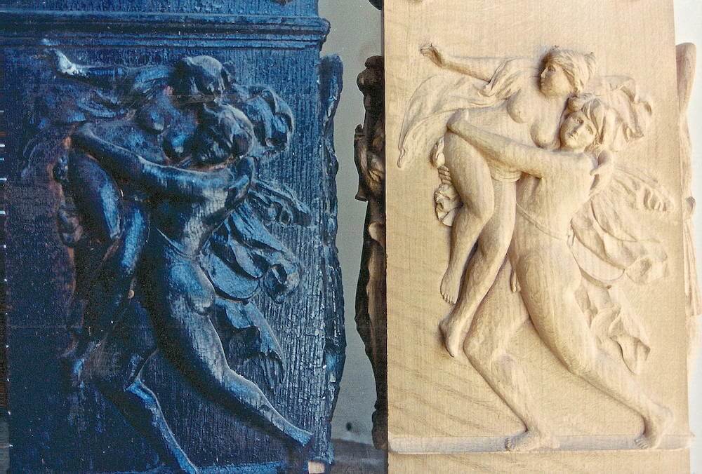 Carved pilaster bases depicting The Rape of the Sabine Women