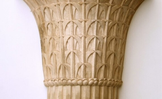A wood Egyptian-style capital, inspired by those at the temple at Philae. Hand-carved by Agrell Architectural Carving.