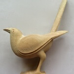 Art Deco-style magpie designed by Joel and Jan Martel and hand-carved by Agrell Architectural Carving.