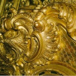 Detail of a gilded Rococo fire surround