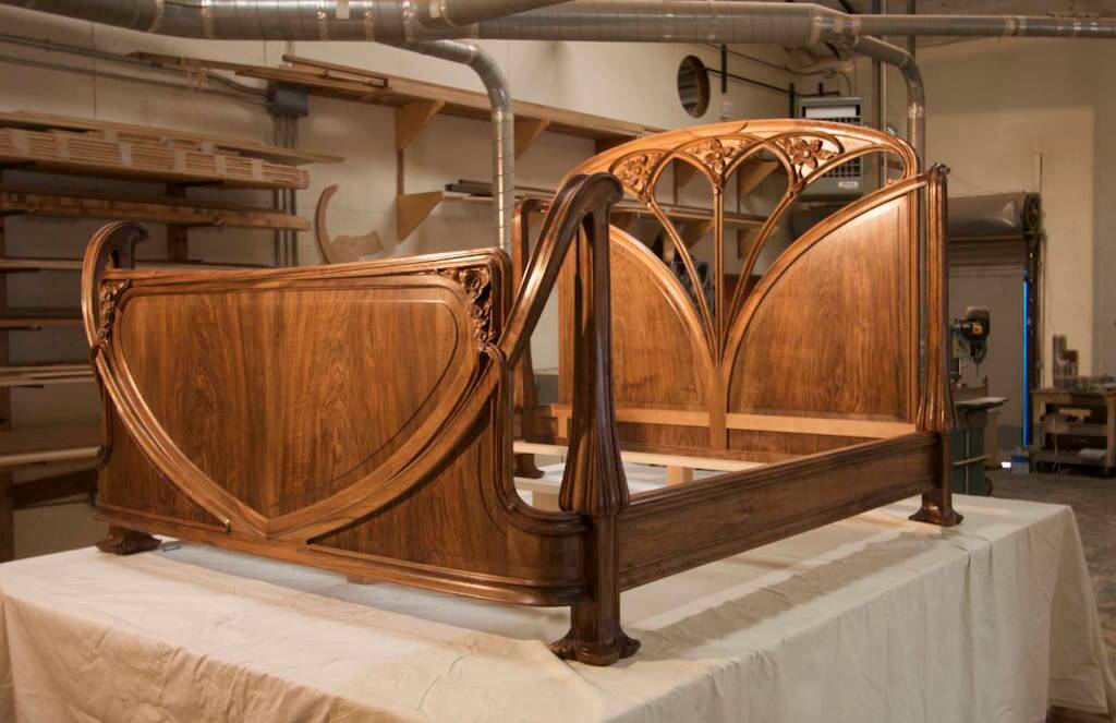 Art Nouveau bed based on a Louis Majorelle design, built and hand-carved in walnut by Agrell Architectural Carving.