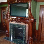 Art Nouveau fire surround, designed and hand-carved in mahogany by Agrell Architectural Carving.