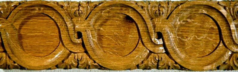 Wood-carved interlace band moulding by Agrell Architectural Carving.