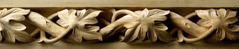 Wood-carved Gothic-style spiraling grape leaf moulding by Agrell Architectural Carving.