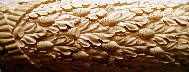 Wood-carved oak leaf and ribbon moulding based on a design found at the Temple of Augustus and Rome in Ankaraby. By Agrell Architectural Carving.