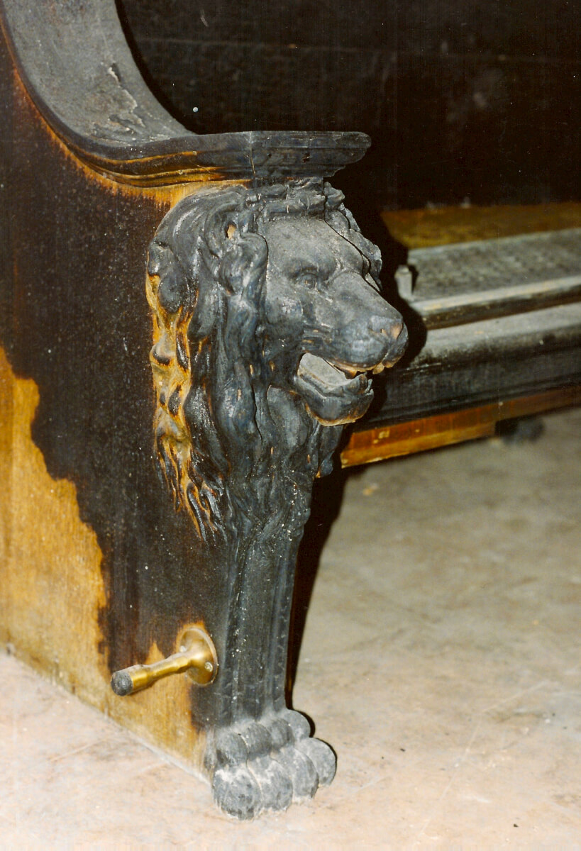 Carved lion bench damaged by fire