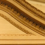 A detail of an oak pediment for the Sultan of Brunei's private London residence, hand-carved by Agrell Architectural Carving.