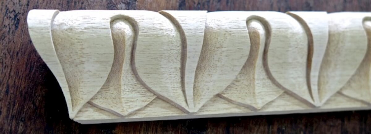 Detail of carved lamb's tongue moulding