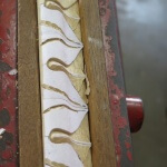 Detail of lamb's tongue moulding being carved