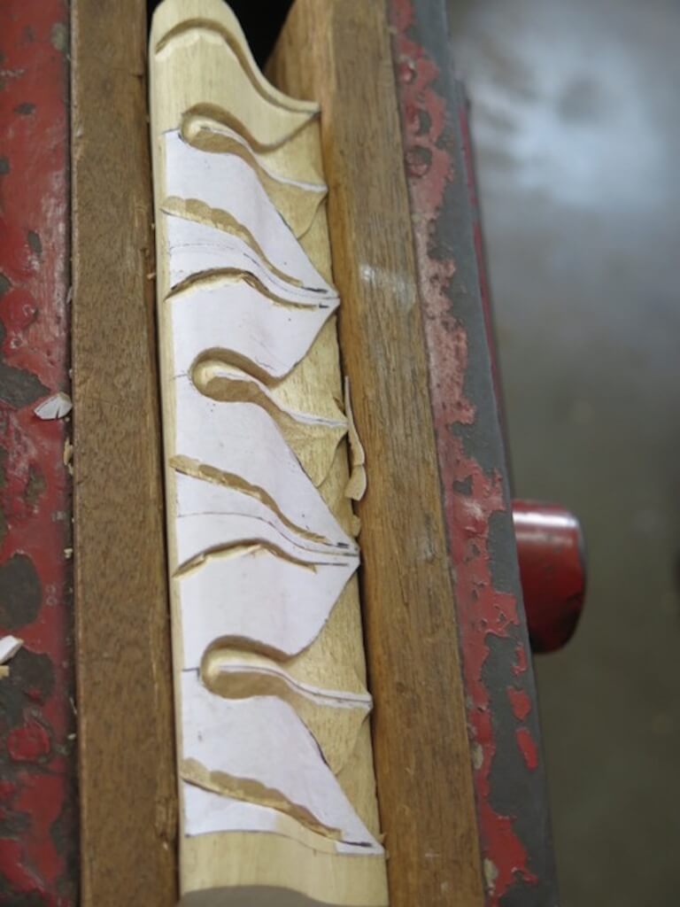 Detail of lamb's tongue moulding being carved