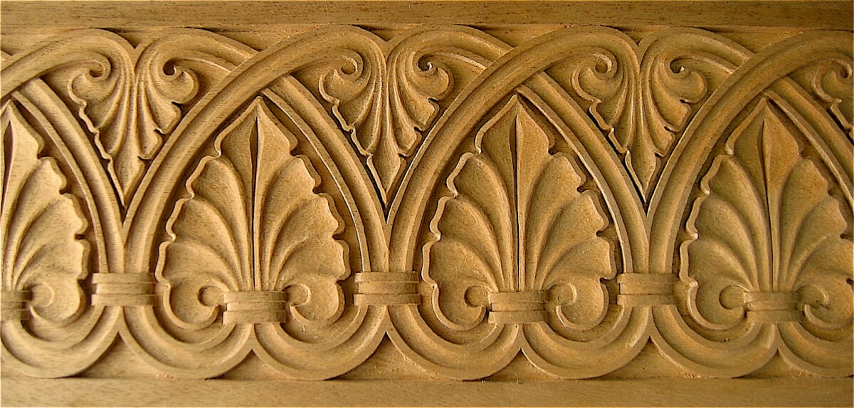 Carved Romanesque-style band moulding